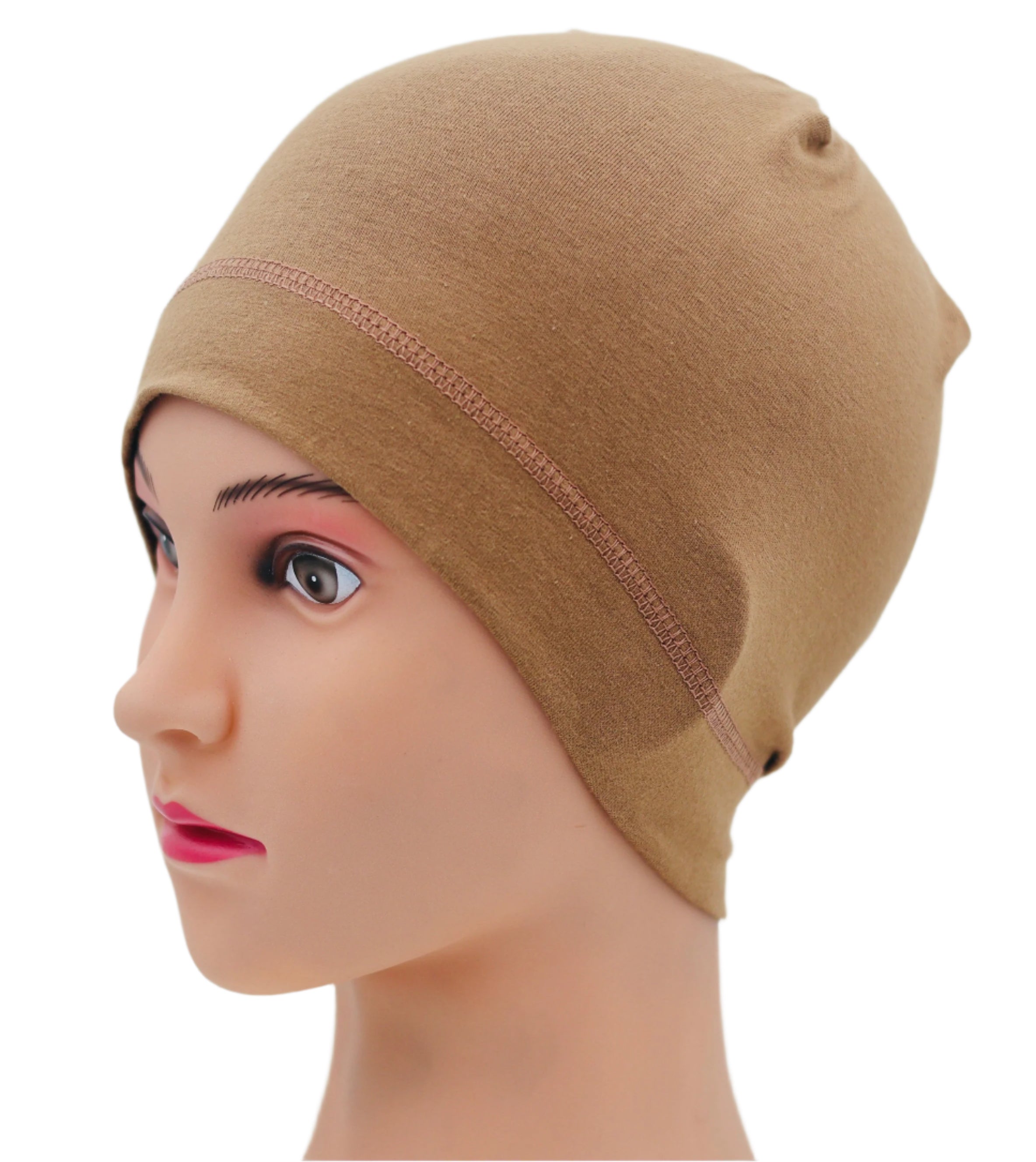 Mannequin head wearing a beige headscarf against a plain background