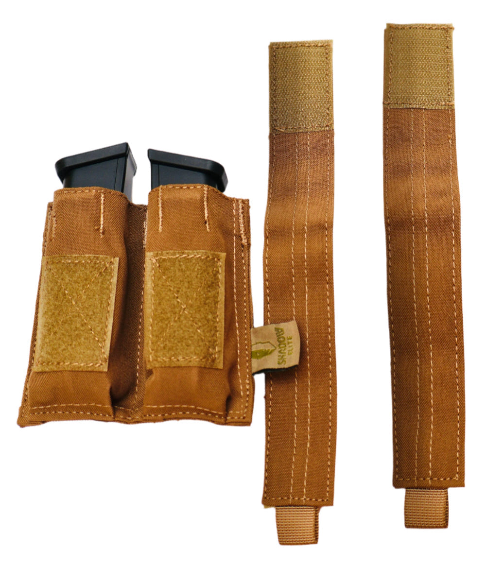 SHE-23030  Double Pistol GRIPTAC Brown tactical magazine pouch with two black magazines on a white background