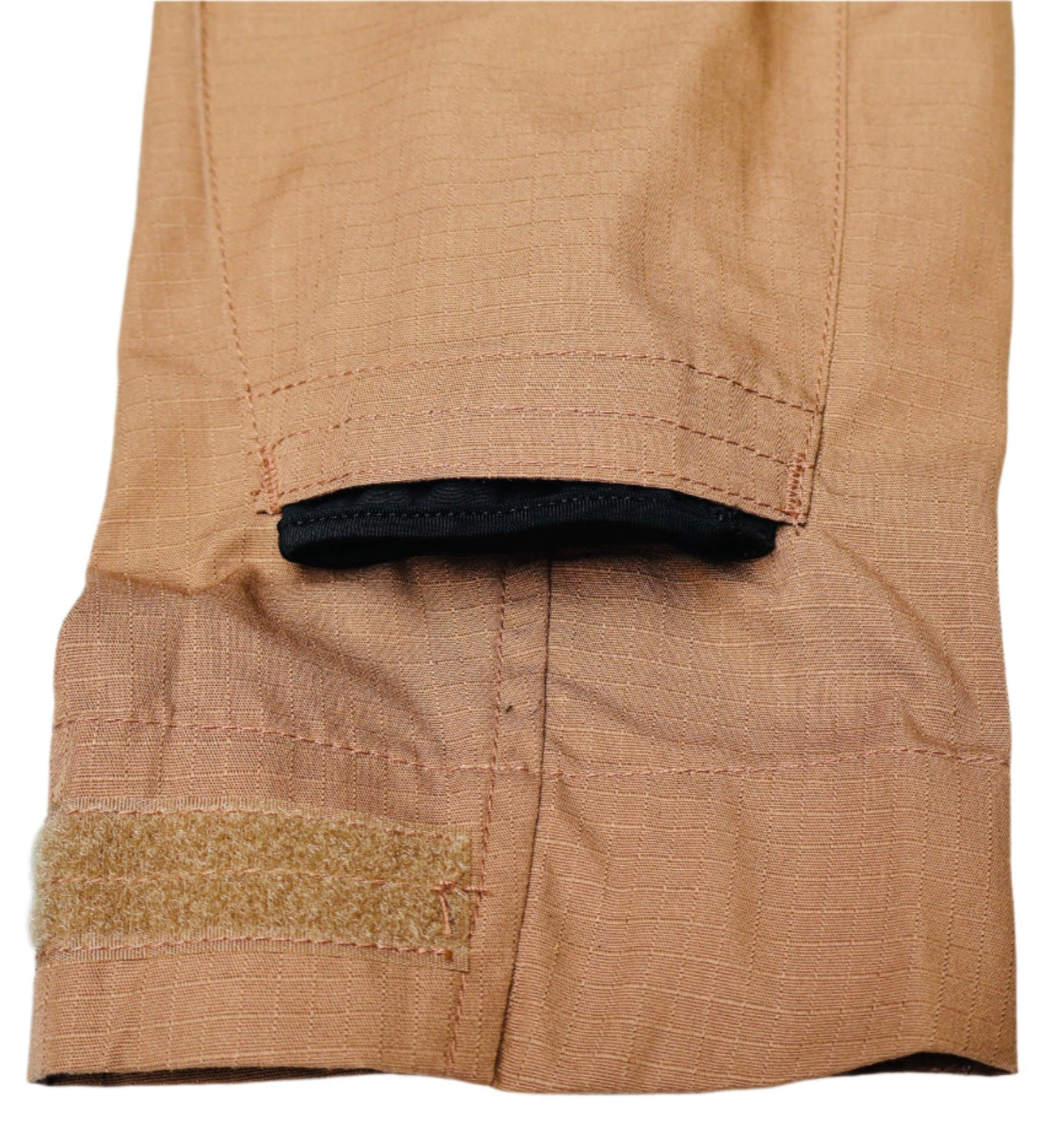 Close-up of a brown fabric with a black trim on a light blue textured background