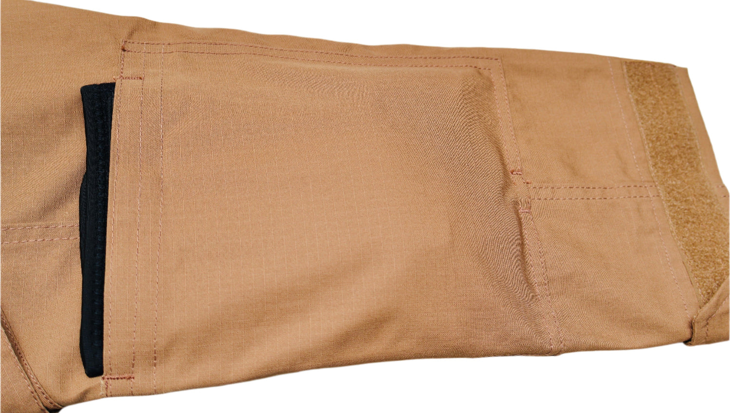 Tan pants with a black stripe on a white background