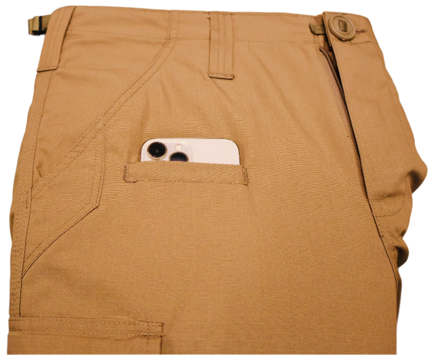 Brown pants with a phone in the pocket on a blurred background