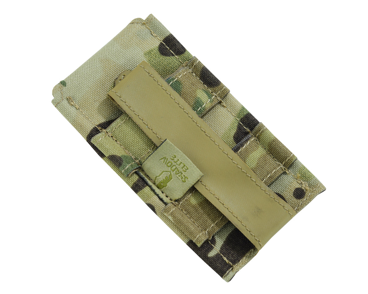 A Multicam / Universal Terrine Pattern  low profile single pistol mag pouch with a Molle system and the brand 'Shadow Strategic' visible on it.